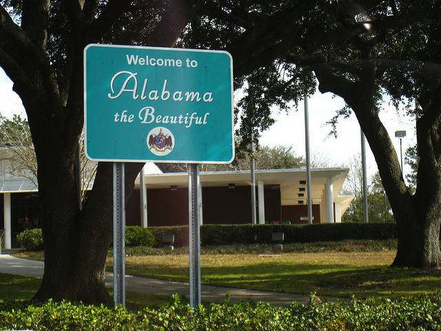 Insurance needs when moving Welcome to Alabama sign