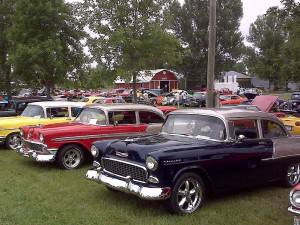 Classic cars parked in a row at show