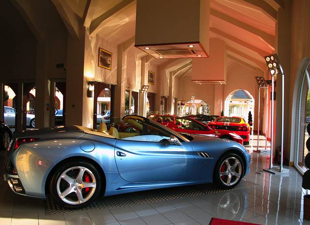 car dealership A modern light blue sports car in a car dealership