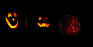 Jack-o-lanterns lit up in the dark