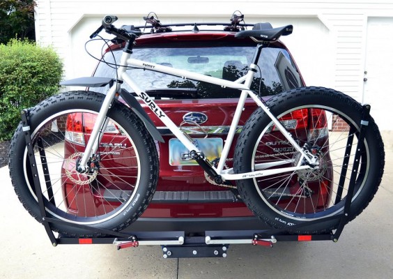 Bike mounted on rack behind SUV