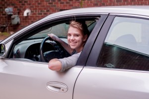 young girl looking out her car window