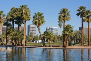 high rise building by a lake