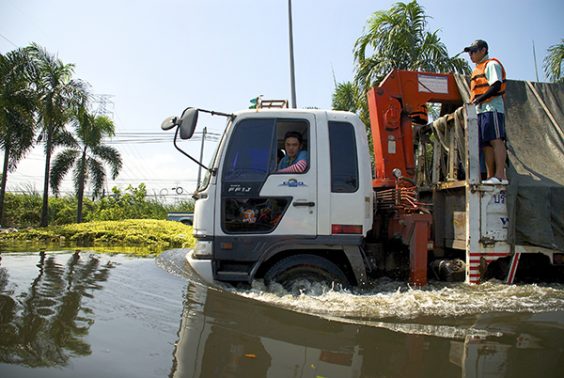 truck moving slowly in flood zone