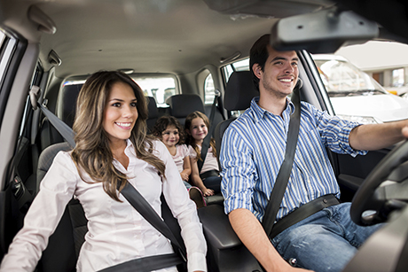 Family driving a car